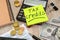 Sticker with tax credit sign on the table. Business concept. Calculator, notepad and dollars. Close-up.