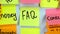 Sticker with the word FAQ stick on a white board