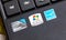 Stickers, manufacturer production labels on a laptop palmrest closeup. Windows 7 Starter logo, Intel Atom, Energy Star symbols
