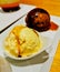 Sticky date sweet gourmet premium icecream with black pudding icrecream at the back