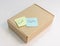 Sticky note of free and gift text on a parcel box