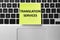 Sticky note with phrase Translation Services on laptop, top view