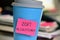 Sticky note with text 2017 resolutions in a cup