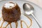 Sticky Toffee Pudding With Caramel Sauce and a Spoon