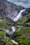 Stigfossen waterfall near Trollstigen or Troll Stairs, a serpentine mountain road that is popular tourist attraction