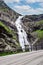 Stigfossen waterfall near Trollstigen or Troll Stairs, a serpentine mountain road that is popular tourist attraction.