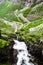 Stigfossen waterfall near Trollstigen or Troll Stairs, a serpentine mountain road that is popular tourist attraction