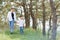 Stilish mother and handsome son having fun on the nature. Happy family concept. Beauty nature scene with family outdoor lifestyle