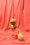 Still life arrangement of cristal glasses filled with small pumpkins