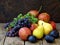 Still life of autumn fruits: grapes, apples, pear, plum