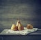 Still life with autumn pears on linen