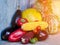Still life of autumn vegetables: melon and watermelon, corn, eggplant, peppers, tomatoes