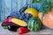 Still life of autumn vegetables: melon and watermelon, corn, eggplant, peppers, tomatoes