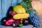 Still life of autumn vegetables: peppers, watermelon, grapes, melon, corn, eggplant