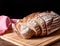 Still life with baked sliced bread loaf. Red dishcloth isolated on background