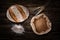 Still life with baking rye bread, ears, flour and bag of grains in a sackcloth