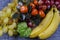 Still life with bananas, grapes and decorative tangerine tree