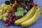 Still life with bananas, grapes and decorative tangerine tree