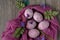 Still life of beautiful textured purple eggs on purple gauze