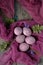 Still life of beautiful textured purple eggs on purple gauze