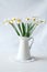 Still life with a blooming bouquet of white daffodils