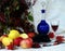 Still life. Blue decanter, apples and mountain ash.