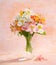 Still life with the bouquet of colorful Alstroemeria flowers in a transparent glass vase on abstract background