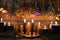 Still life with burning candles and dry herbs on witch table