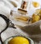 Still life with cardigan, perfume and pendant