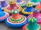 Still life of colorful painted pottery lids on sackcloth backgro