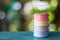 Still life with colorful retro food carrier on blue wooden table