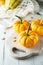 Still life composition with colorful decorative mini pumpkins and pumpkin seeds. Mini orange pumpkins, holiday decoration