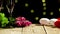 Still life confined to Valentine\'s day with two wineglasses and roses lying next to grape