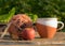 Still life with a cup of tea and a ball of yarn on an old wooden background, beautiful texture, fuzzy background, autumn