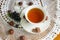 Still life with a cup of tea on a beautiful napkin