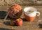 Still life with a cup of tea, a book and a ball of yarn on an old wooden background, beautiful texture, fuzzy background, autumn