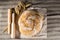 Still life with delicious baked good, wheat and wooden pestles o