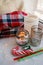 Still life details with candles, toy candy cane and garland. Scandinavian hygge concept, christmas and new year stll life