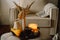 Still life details in home interior of living room. Pumpkin and cup of tea with candles on a serving tray. Rest and Reading