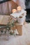 Still life details of interior: knitted clothes on a vintage wooden floor, cup of tea and book