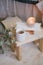 Still life details of interior: knitted clothes on a vintage wooden floor, cup of tea and book