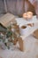 Still life details of interior: knitted clothes on a vintage wooden floor, cup of tea and book