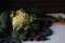 Still life of different kinds of cabbage on the table: Lacinato kale, Blue Curled Vates Kale, Cauliflower, Brussels sprouts end Br