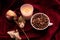 Still life with dried rose, candles, cup of coffee beans