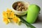 Still life - Easter decoration - daffodiles, eggs in a basket and green candle