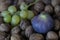 Still life with a fig walnuts and grapes