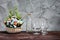 Still Life flower with differently shaped glass bottles