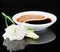 Still life of flower eustoma and soy sauce on a black background
