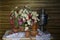 Still life with flowers, Russian samovar, old household items on a wooden background .