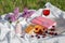 Still life and food photo. Cherry and waffle berries lie on a wicker round napkin and crumpled fabric